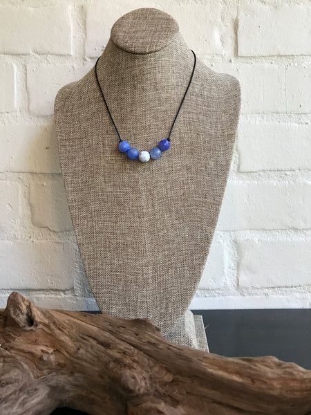 This 18 inch periwinkle fire agate natural stone necklace was created by our jewelry designer, Dixie Klein. Pair it with our Periwinkle Ruffle Bell Sleeve Dress for the perfect look! 19 inches long. 
