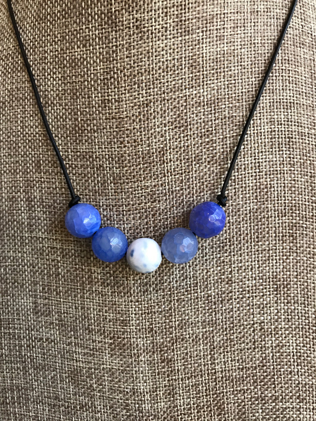 This 18 inch periwinkle fire agate natural stone necklace was created by our jewelry designer, Dixie Klein. Pair it with our Periwinkle Ruffle Bell Sleeve Dress for the perfect look! 19 inches long. 