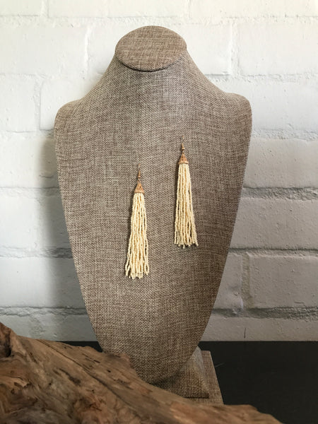 Look stunning in these ivory seed bead tassel hook earrings. Ivory earrings and a swing dress! Ready for anything!