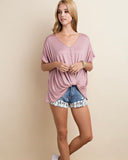 New ee:some tops are in just in time for the Spring! This one is features super soft Modal fabric and a deep v-neck and twist tie front.  Super cut to wear with leggings, jeans or shorts!  and has self ties on the three quarter length sleeves. It comes in pretty blush or black.  Comes in Small- Large 96% Rayon 4% Spandex Made in the USA