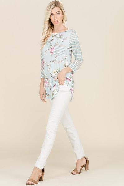 Let this top put you in a spring mood! It features a modest length that covers the hips and a spring floral print with contrasting stripes. This light weight top is brought to you by Lovely J. 