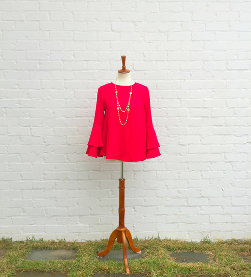 This elegant red blouse is perfect for holiday parties and family gatherings. It has a round neckline with double bell sleeves. Wear it with our layered freshwater pearl and Celtic symbol necklace found in our accessories collection.﻿
