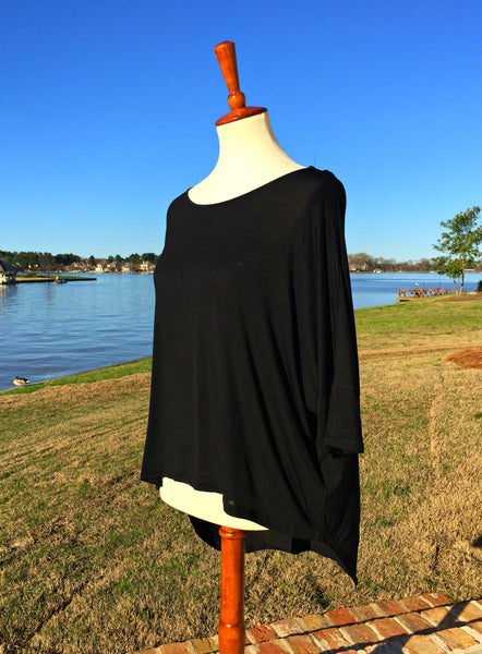 This 3/4 sleeve top from She & Sky features light weight material and a lovely, partially open, back detail. This style is longer in the back, a look that is very stylish (20 inches long in the front and 28 inches long in the back). Wear it with you favorite jeans and sandals for a great spring look. 
