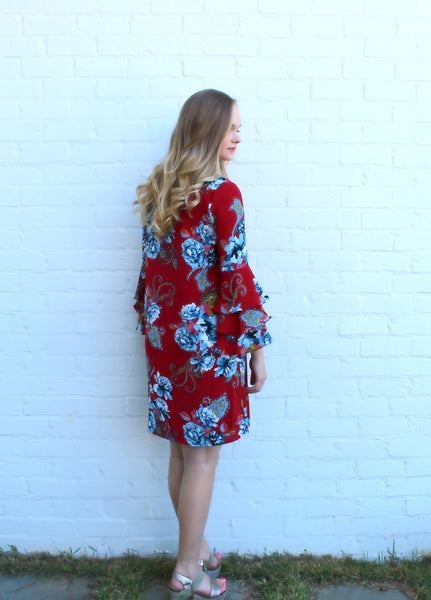 We absolutely love this wrinkle free, deep red, floral dress with ruffle sleeve detail. The colors on this lined dress are gorgeous! Pair it with our large tassel earrings for an awesome look.