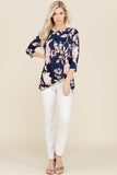 This new Spring top is feminine and sweet with soft pink flowers and taupe leaves on a navy background. It's also knotted for an updated style. Perfect for a girl's night out with jeans or white capris. 94% polyester 6% spandex.