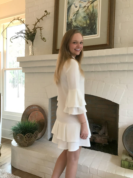 You will look beautiful in this ivory dress with ruffle detail in the sleeves and hem. It is so elegant. It has a mock neck that fits comfortably.  