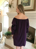 You will love this chic knit dress with ruched sleeve detail. The royal purple color is amazing! Wear it off the shoulder for a dramatic look or up for a more conservative look. Wrinkle free polyester. 