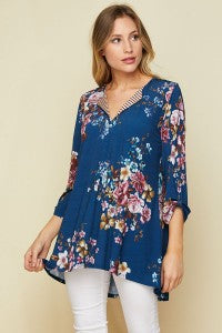 Can you say comfort? Honeyme has done it again with this gorgeous navy floral with striped V-neck detail, tab sleeves, and a roomy fit. 