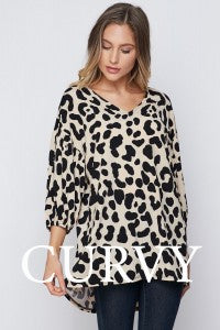 Take a walk on the wild side in this striking animal print top from Honeyme. Comes in 1X - 3X. 